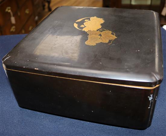 A Japanese gilt decorated black lacquer rectangular box and cover, late 19th/early 20th century, width 27.5cm